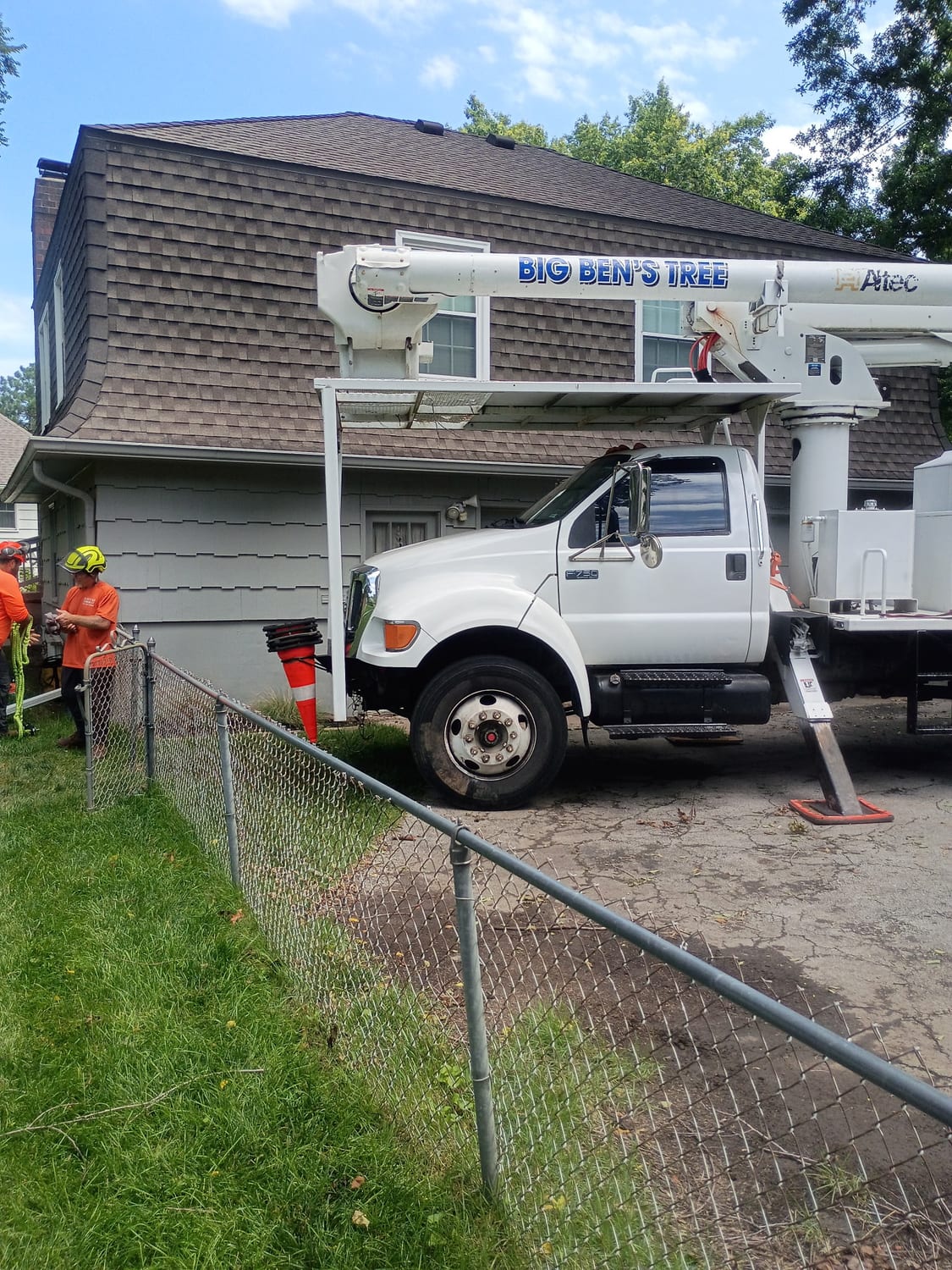 Big Ben's branded bucket truck on a job